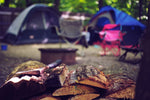 Campfire in the woods at night – best camping gifts UK for outdoor lovers