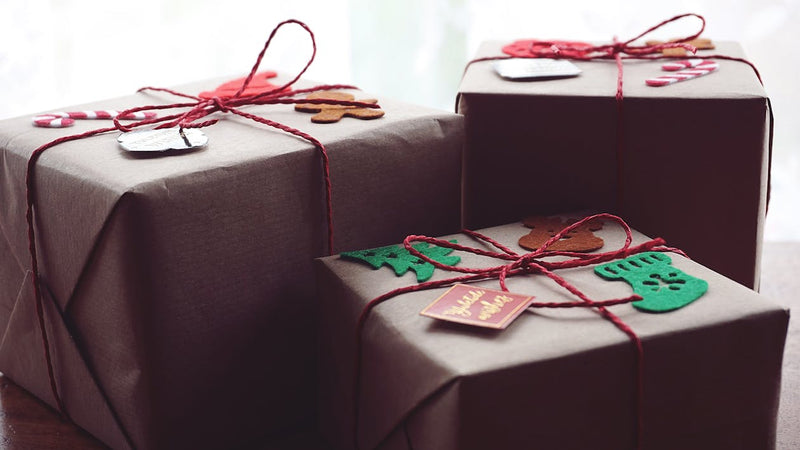 Three colourful gift boxes wrapped and ready to surprise