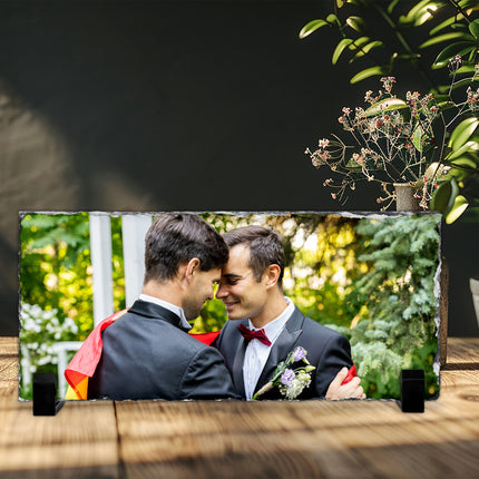 Freestanding rectangular photo slate displaying a couple photograph on a wooden shelf